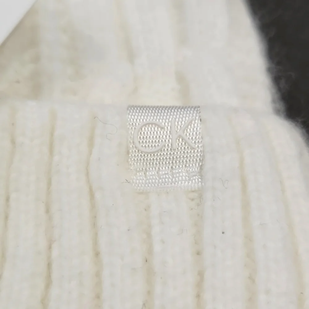 NWT Calvin Klein Cream Faux Fur Pom-Pom Knit Beanie Hat One Size MSRP $48 - Picture 4 of 10